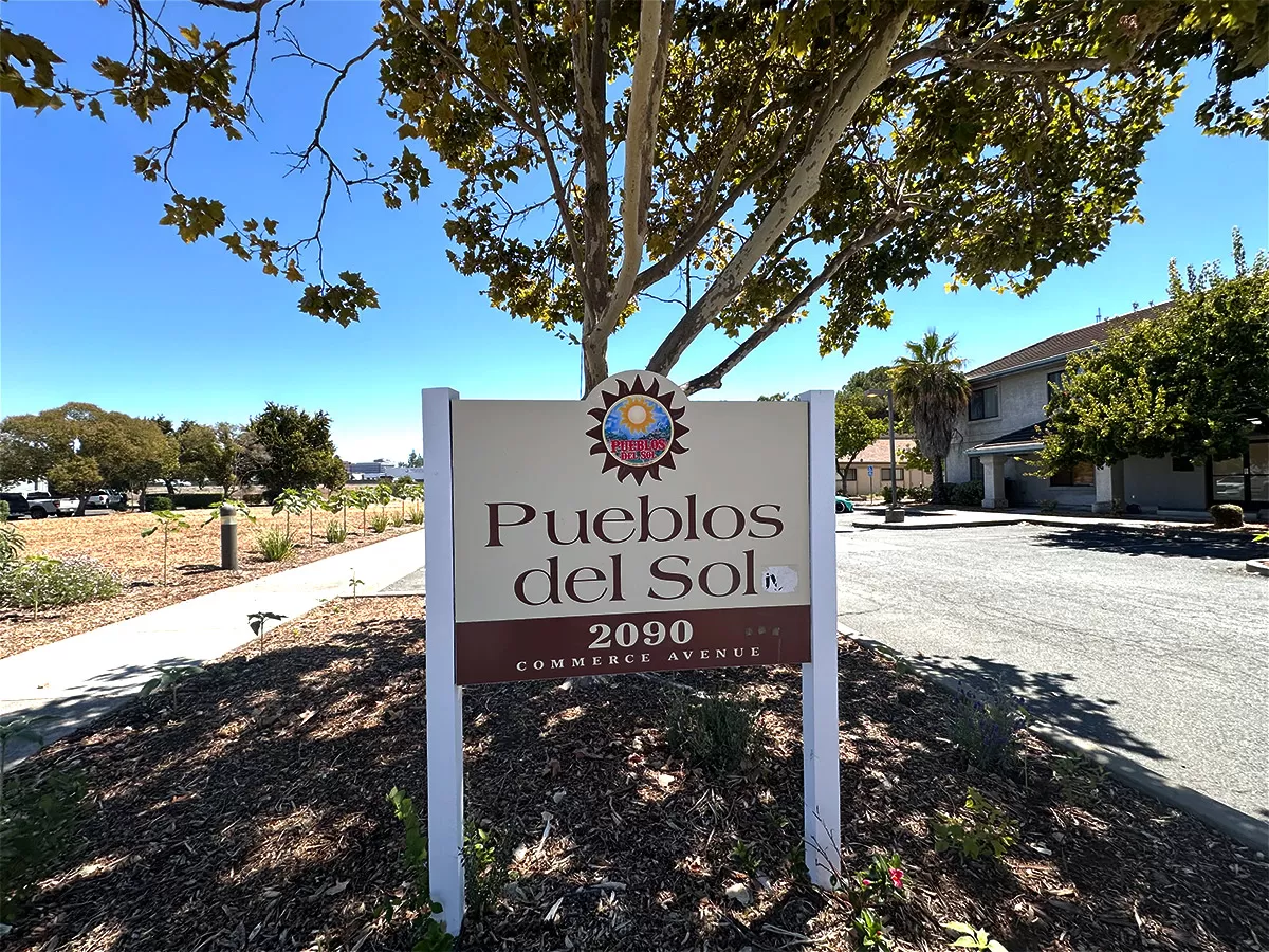 Pueblos Del Sol sign
